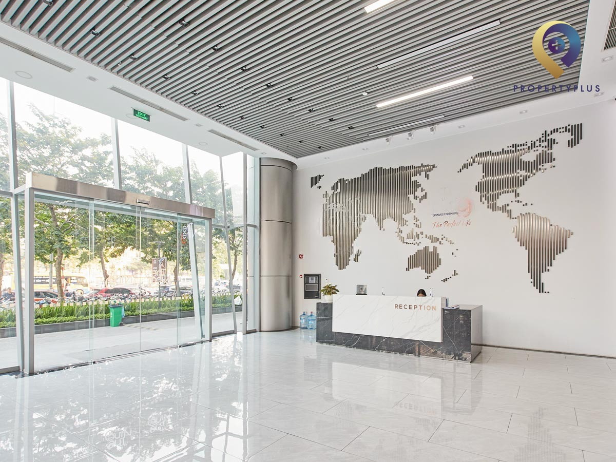 Reception area of The Nine office building with modern decor and world map wall art